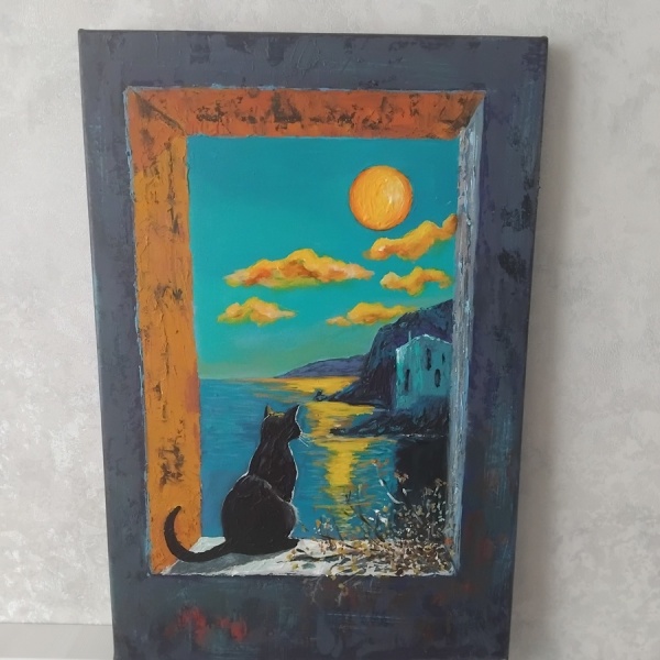 Dənizi seyr edən pişik